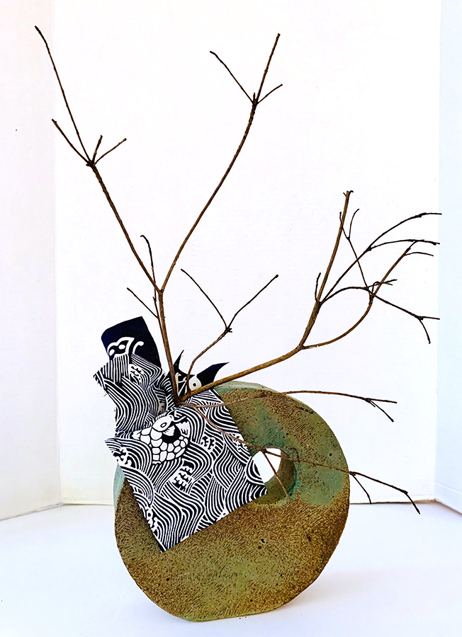 Margaret - Simple dried branch set with Japanese Shibori  fabric in a self made container makes for an elegant arrangement 